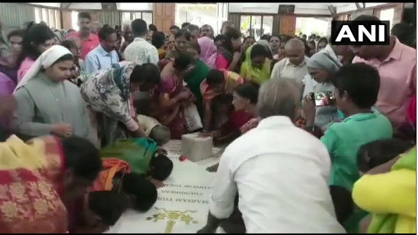 People gather at the shrine of Mother Mariam Thresia at Kuzhikkattussery in Thrissur People gather at the shrine of Mother Mariam Thresia at Kuzhikkattussery in Thrissur
