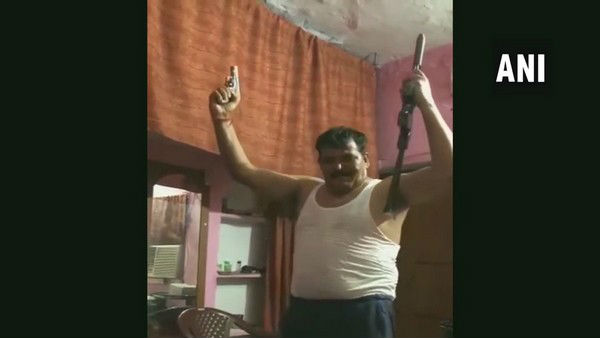 Uttarakhand Man dances with 2 guns in his hand viral video Uttarakhand Man dances with 2 guns in his hand viral video