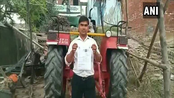 Tractor driver fined Rs 3,000 for driving without helmet, licence in Hapur Tractor driver fined Rs 3,000 for driving without helmet, licence in Hapur