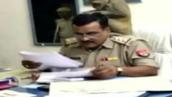 monkey looking for lice on UP Cop head viral video monkey looking for lice on UP Cop head viral video