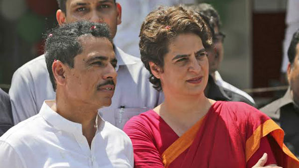 Robert Vadra stands with wife Priyanka Gandhi after UP Police manhandles her Robert Vadra stands with wife Priyanka Gandhi after UP Police manhandles her