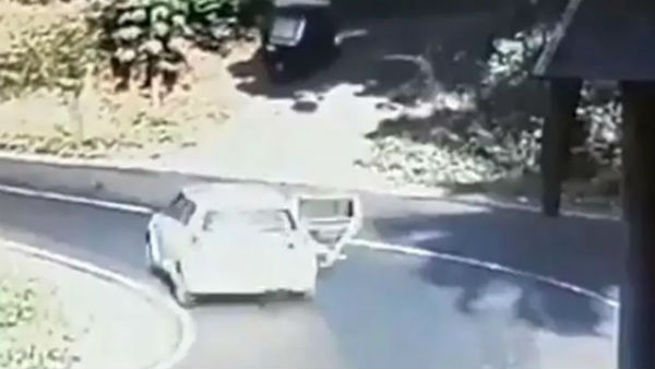 Chilling Video: Childs Miraculous Escape After Falling Off A Moving Car in Kerala Chilling Video: Childs Miraculous Escape After Falling Off A Moving Car in Kerala