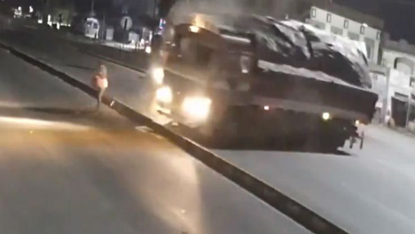 Miraculous escape for man crossing road as 2 lorries collide.. Miraculous escape for man crossing road as 2 lorries collide..