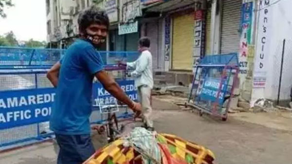 Sanitation worker carries a dead body on bicycle in kamareddy. Sanitation worker carries a dead body on bicycle in kamareddy.