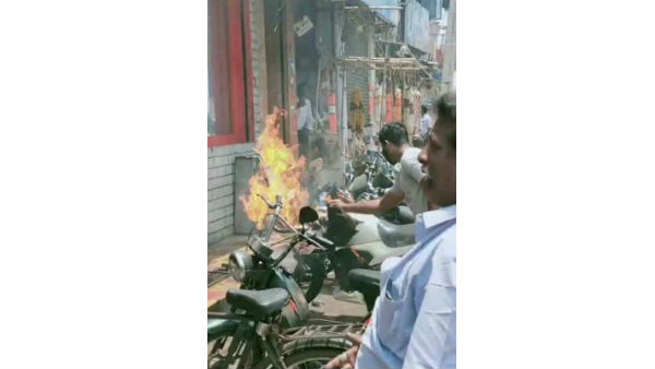 people panic after sanitizer burnt in a bike in rajahmundry people panic after sanitizer burnt in a bike in rajahmundry