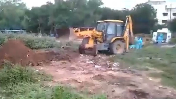JCB takes COVID 19 patients dead body to the burial at Tirupati in Chittoor district JCB takes COVID 19 patients dead body to the burial at Tirupati in Chittoor district