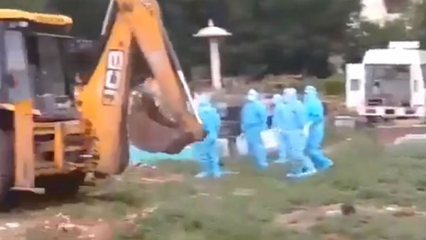 JCB takes COVID 19 patients dead body to the burial at Tirupati in Chittoor district JCB takes COVID 19 patients dead body to the burial at Tirupati in Chittoor district