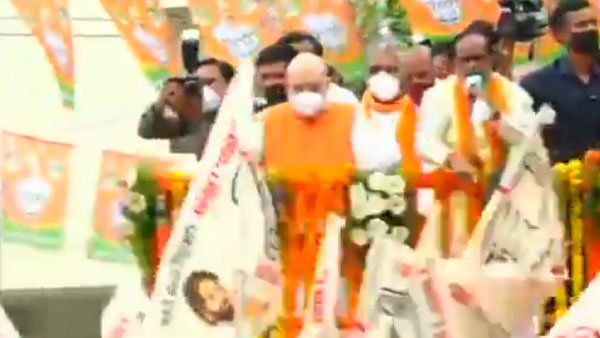 Amit shah Road show: Jana Sena Party flags seen more than BJP flags in the show of strength Amit shah Road show: Jana Sena Party flags seen more than BJP flags in the show of strength
