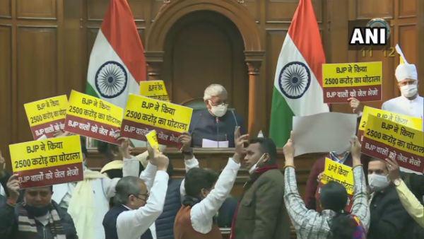 Aam Aadmi Party MLAs display placards and banner alleging BJP of a Rs 2,500 crores scam Aam Aadmi Party MLAs display placards and banner alleging BJP of a Rs 2,500 crores scam