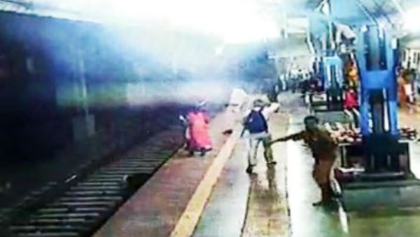 Woman falls on Mumbai local railway track, saved by RPF constable.. Woman falls on Mumbai local railway track, saved by RPF constable..
