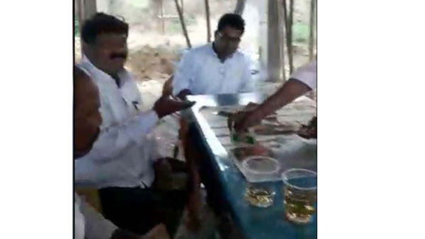 Alcohol drunken MEO and teachers played poker at school in adilabad district Alcohol drunken MEO and teachers played poker at school in adilabad district