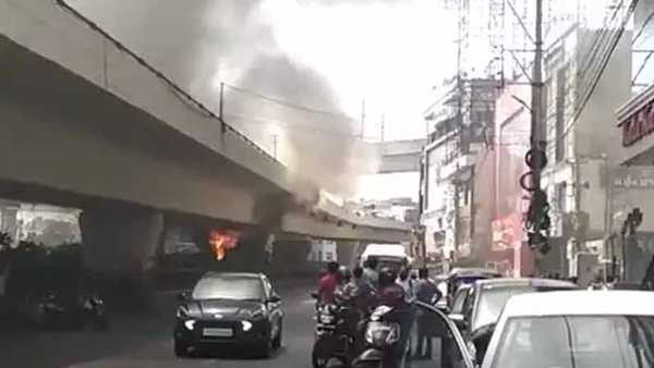 fire accident under panjagutta flyover in hyderabad, traffic stopped a for while fire accident under panjagutta flyover in hyderabad, traffic stopped a for while