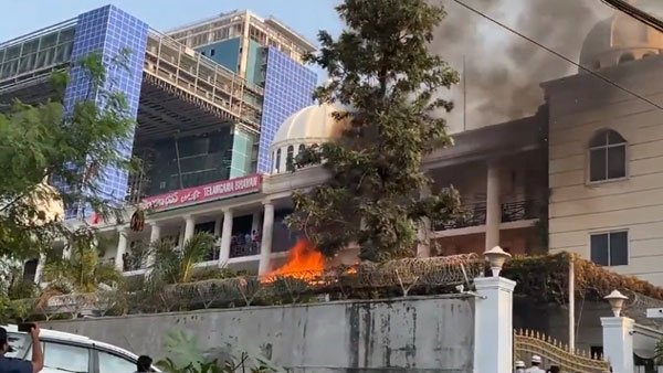 TRS Leader Kattela Srinivas Yadav Stir with a gun in Telangana Bhavan at fire accident TRS Leader Kattela Srinivas Yadav Stir with a gun in Telangana Bhavan at fire accident