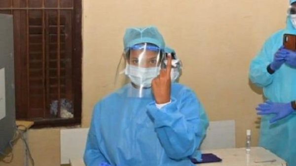 Tamil Nadu polls COVID positive DMK MP Kanimozhi votes wearing PPE kit Tamil Nadu polls COVID positive DMK MP Kanimozhi votes wearing PPE kit
