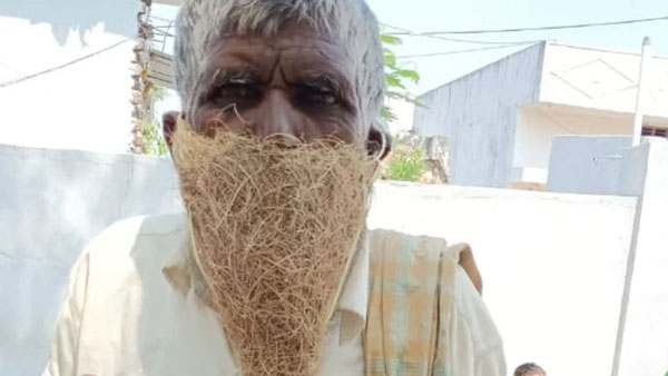 photo of a Telangana shepherd using a birds nest to cover his face has gone viral photo of a Telangana shepherd using a birds nest to cover his face has gone viral