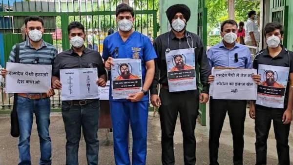 Baba Ramdevs comments on allopathy: Doctors protest with slogans on PPE, black bands Baba Ramdevs comments on allopathy: Doctors protest with slogans on PPE, black bands