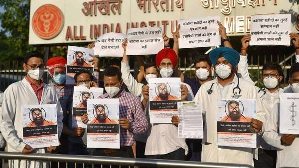 Baba Ramdevs comments on allopathy: Doctors protest with slogans on PPE, black bands Baba Ramdevs comments on allopathy: Doctors protest with slogans on PPE, black bands