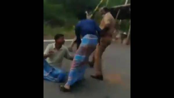 చెక్ పోస్టులో చితకబాదిన ఎస్ఐ