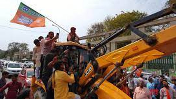 బుల్డోజర్ లపైకి ఎక్కి సంబరాలు