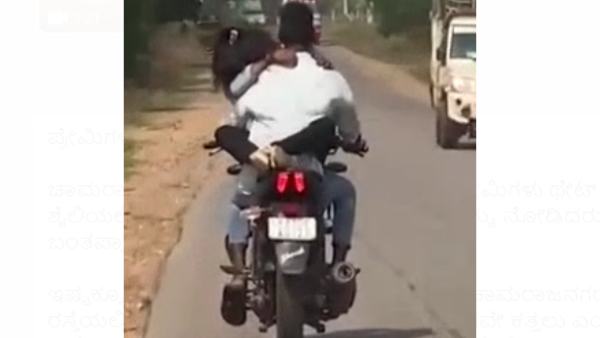 బైక్ పెట్రోల్ ట్యాంక్ మీద ప్రియురాలు