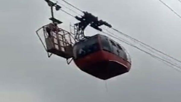 two tourists stranded mid-air in cable car two tourists stranded mid-air in cable car