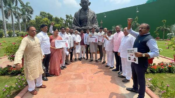 TRS MPs hold protest at Mahatma Gandhi statue in Parliament premises against the price rise TRS MPs hold protest at Mahatma Gandhi statue in Parliament premises against the price rise