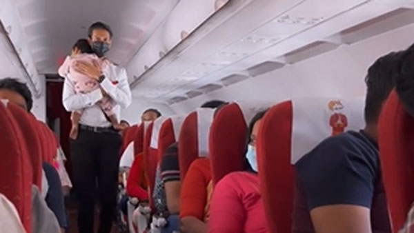 Watch:Air India Flight Attended Consoling Little Baby Watch:Air India Flight Attended Consoling Little Baby